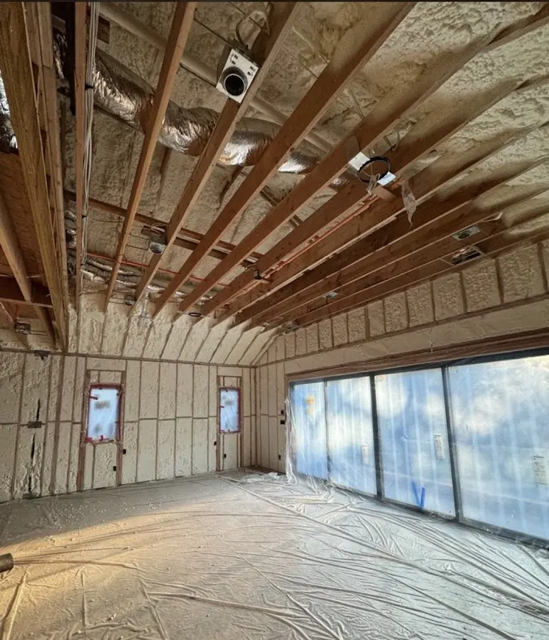 Interior walls and ceiling insulated with spray foam during new construction in Hanson